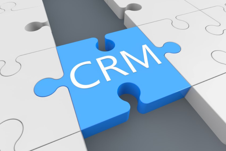 puzzle pieces with one showing CRM to represent Sage CRM