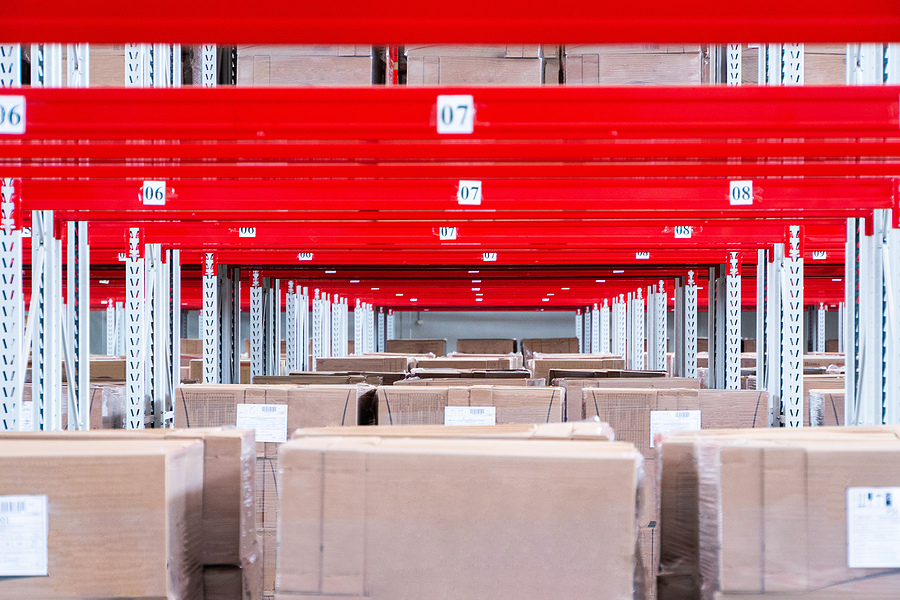 boxes on shelves in warehouse, supply chain management