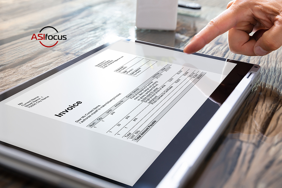 person pointing to online invoice on tablet computer