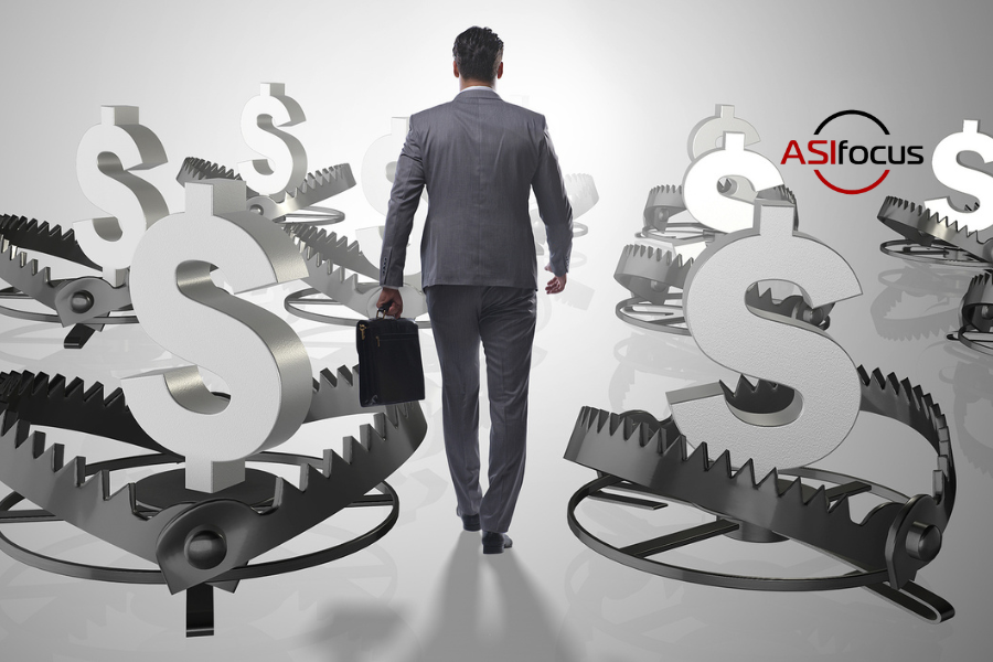 person walking through mousetraps that have caught money. Financial Risk